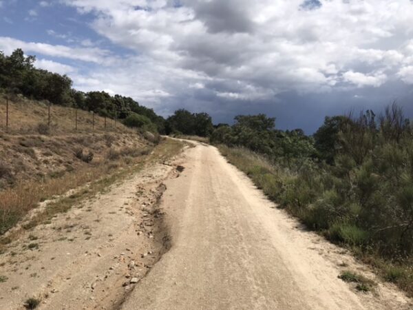  A muddy, craggy camino trail in the mountains.