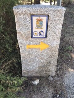 An elaborate granite marker in the forest on the camino.