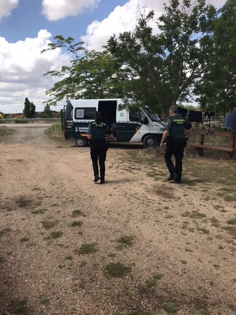 Guardia civil officers walking to vehicle after safety check on the camino.