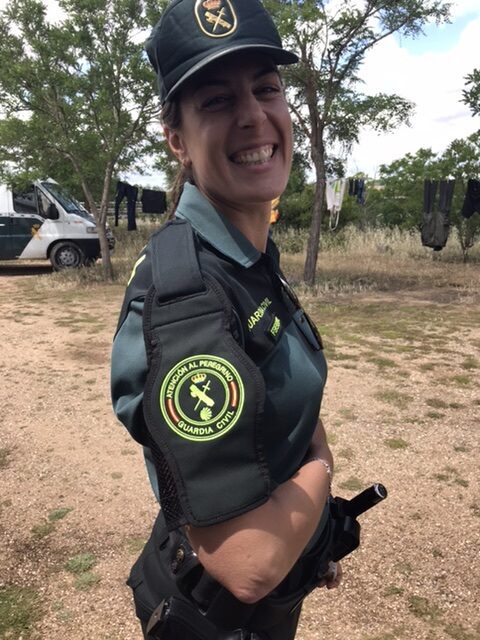 Guardia civil officer performing a safety check.