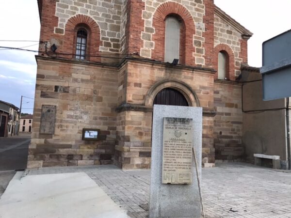 The plaque in front of the church .