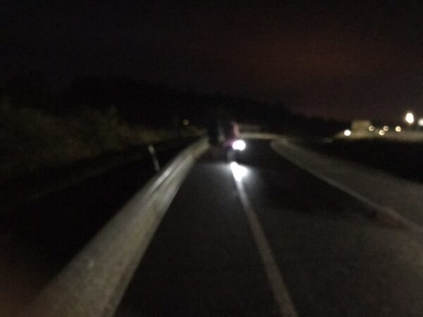 Flashlights and a dark highway headed toward Santiago.