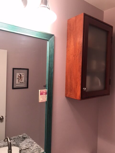 New wall cabinet and mirror frame after powder room renovation.