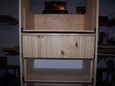 Test fitting a drawer front on the wall chest.