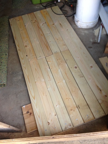 One of the shed doors constructed with old and new wood.