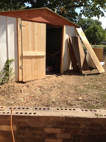 Testing and tweaking one of the new shed doors.