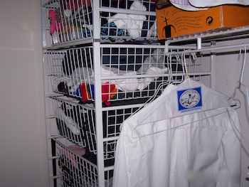 Wire baskets in a closet.