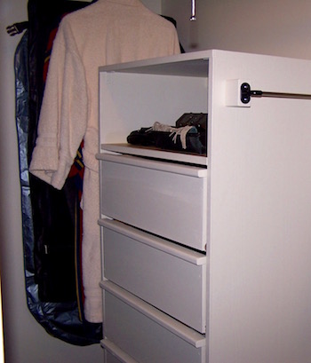 Hanging closet wall chest with clothing added.