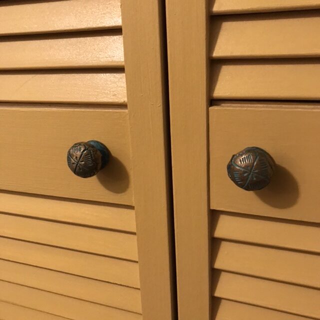 Another closet door with louvered slats.